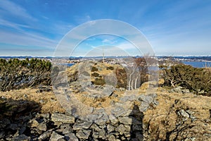 Scenic view from top of the small hill in Snode suburb with Hafsfjord fjord and Madla suburb on background