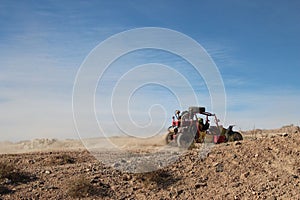 Scenic view of a tractor plowing land in the countryside on a sunny day