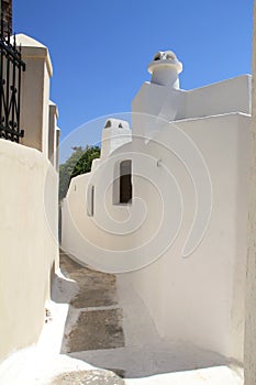 Scenic view of traditional cycladic white houses and blue sky in Oia village, Santorini island, Greece