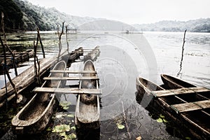 Scenic view of traditional fisher boats on Danau Tamblingan lake