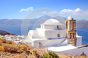 Scenic view of traditional greek cycladic church, village and se
