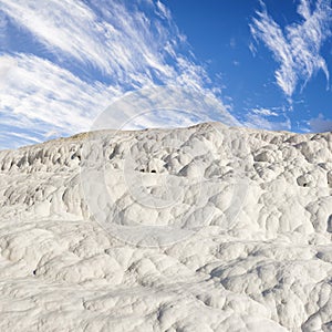 Scenic view of travertine terraces in Pamukkale Turkey. Crystallised calcium formations formed by thermal spring water