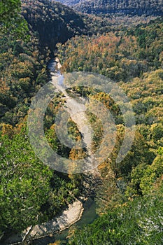 A scenic view of trees changing color and the Buffalo River in the Ozark Mountains