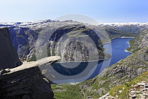Scenic view of Trolltunga the famous Troll`s tongue Norwegian destination and Ringedalsvatnet Lake in Odda, Norway