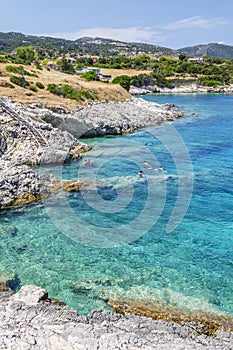 Scenic view on turquoise rocky beach situated on the north east coast of Zakynthos island, Greece.