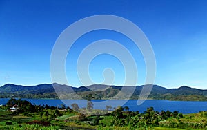 Scenic view of Twin lake against clear blue sky, Solok, West Sumatra, Indonesia