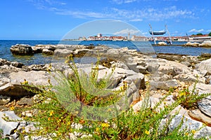 Scenic view of Umag old town, Istria, Croatia. Summer landscape with medieval architecture, blue sea and sky, travel background