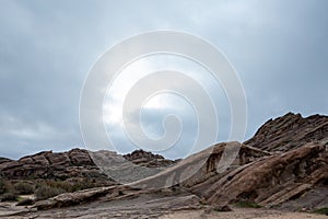 Scenic view of Vasquez Rocks Park in Agua Dulce, California against a clouded sky photo