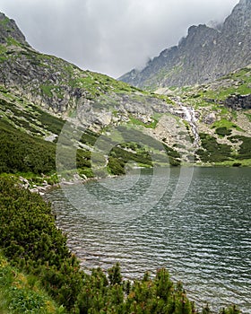 Scenic view of Velicke Pleso Velicke Tarn and waterfall in High Tatras mountains, Slovakia. Beautiful clean nature in Central