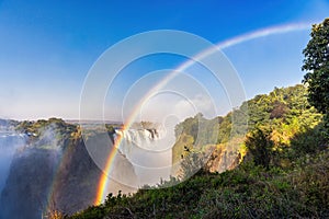 Scenic view of Victoria Falls with rainbow on the border between Zambia and Zimbabwe