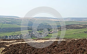 Scenic view of the village of old town in calderdale west yorkshire with surrounding pennine farms and hills with midgley moor