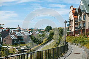 A scenic view of Vilnius residential districts Paupys and Uzupis, showcasing a blend of modern and traditional architecture amidst