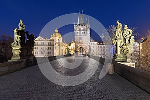 Scenic view on Vltava river, Charles bridge and historical center of Prague, buildings and landmarks of old town at sunrise