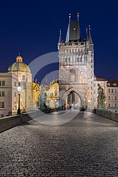 Scenic view on Vltava river, Charles bridge and historical center of Prague, buildings and landmarks of old town at sunrise