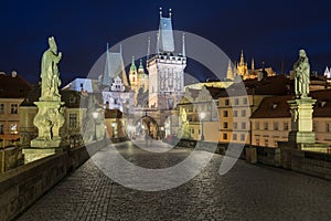 Scenic view on Vltava river, Charles bridge and historical center of Prague, buildings and landmarks of old town at sunrise