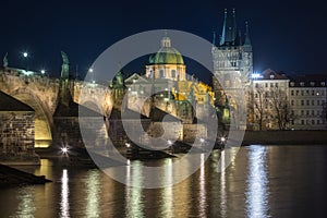 Scenic view on Vltava river, Charles bridge and historical center of Prague, buildings and landmarks of old town at sunrise