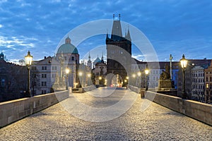 Scenic view on Vltava river, Charles bridge and historical center of Prague, buildings and landmarks of old town at sunrise