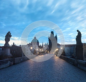 Scenic view on Vltava river, Charles bridge and historical center of Prague, buildings and landmarks of old town at sunrise