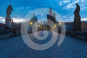 Scenic view on Vltava river, Charles bridge and historical center of Prague, buildings and landmarks of old town at sunrise