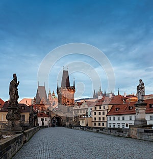 Scenic view on Vltava river, Charles bridge and historical center of Prague, buildings and landmarks of old town at sunrise