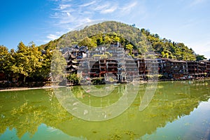 Scenic view of the Wanming Pagoda reflected in water of the Tuojiang River Tuo Jiang River in Phoenix Ancient Town