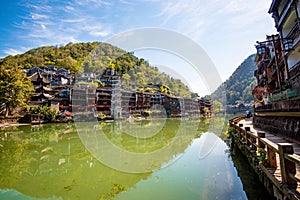 Scenic view of the Wanming Pagoda reflected in water of the Tuojiang River Tuo Jiang River in Phoenix Ancient Town