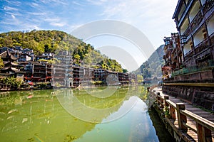 Scenic view of the Wanming Pagoda reflected in water of the Tuojiang River Tuo Jiang River in Phoenix Ancient Town