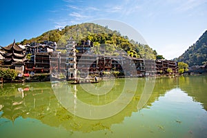 Scenic view of the Wanming Pagoda reflected in water of the Tuojiang River Tuo Jiang River in Phoenix Ancient Town