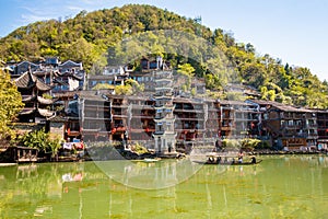 Scenic view of the Wanming Pagoda reflected in water of the Tuojiang River Tuo Jiang River in Phoenix Ancient Town