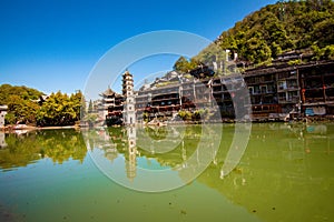 Scenic view of the Wanming Pagoda reflected in water of the Tuojiang River Tuo Jiang River in Phoenix Ancient Town