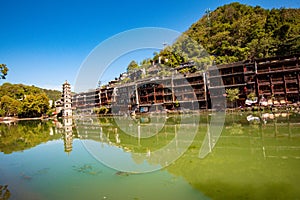 Scenic view of the Wanming Pagoda reflected in water of the Tuojiang River Tuo Jiang River in Phoenix Ancient Town