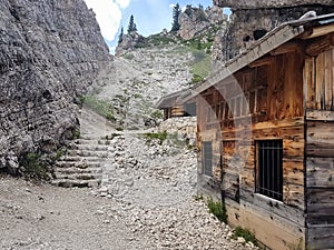 Old barrack in rocky landscape of Dolomite mountains, Italy