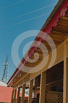 Scenic view of wooden huts in Shogran, Pakistan against a blue sky