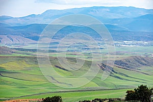 Scenic views of green fields and mountains from the Aures region in Batna, Algeria