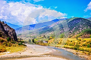 The scenic views of the Punakha valley , Pho Chhu river and surrounding mountains.