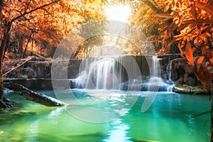 Scenic waterfall in rainforest on autumn season at Huai Mae Khamin national park photo