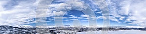 Scenic wide aerial panorama view on Scandinavian Mountains close to Joesjo lake in Swedish Lapland in winter cover, frosty sunny