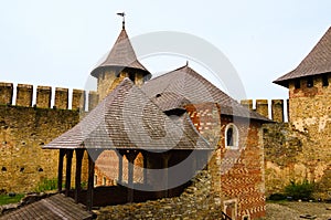 Scenic wide-angle view of courtyard with ancient stone buildings in the medieval castle