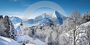 Scenic winter landscape in the Alps with church