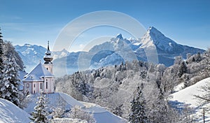 Scenic winter landscape in the Alps with church