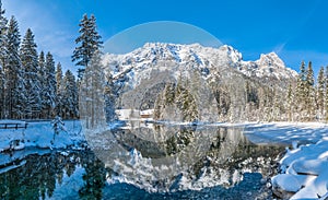 Scenic winter landscape in Bavarian Alps at idyllic lake Hintersee, Germany