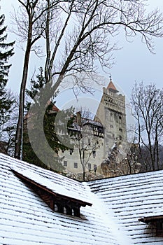 Scenic winter landscape of Bran Castle on the hill. Also called Dracula`s Castle. Famous touristic place and travel destination