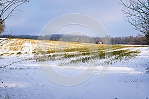 Scenic winter landscape of countryside covered in snow in Lasne, Belgium