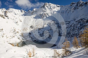 Scenic winter landscape with Erdemolo Lake. Lagorai Mountains, Italy