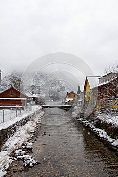 Scenic winter landscape with a picturesque stream in Hallstatt, Austria