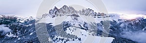 Scenic winter mountain landscape in Alps with aerial panoramic view of Geisler Peaks from Adolf Munkel trail in Zanser Alm, South