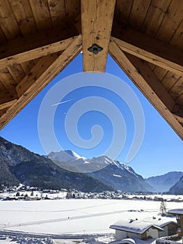 Scenic winter snow landscape in Tyrol, Austria seen from a window