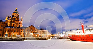 Scenic winter view the frozen Old Port in Katajanokka district with Uspenski Orthodox Cathedral in Helsinki Finland