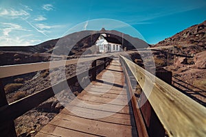 Scenic wooden bridge and town in old desert town at arizona desert.