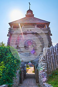 The scenic wooden tower with arched passway and surrounding stockade,  Zaporizhian Sich scansen, Zaporizhzhia, Ukraine